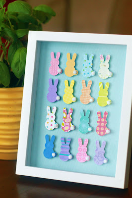 Framed collage of colourful bunnies crafted at home