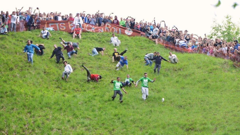 Photograph of participants in Cheese Rolling event on Cooper’s Hill in Gloucestershire