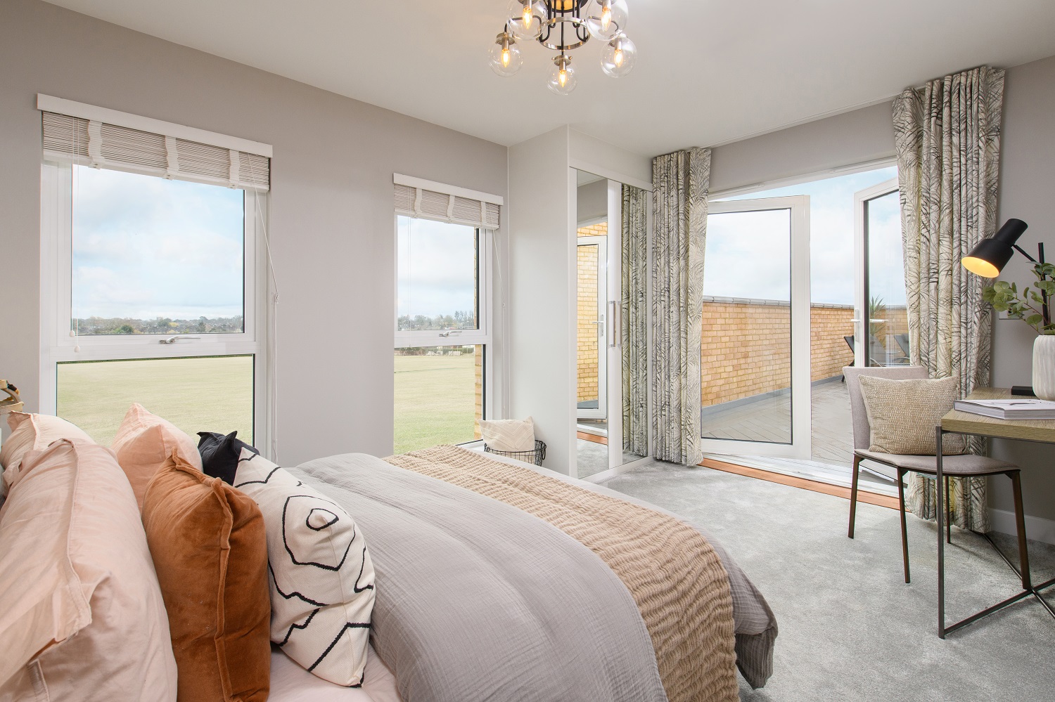Main bedroom features floor-to-ceiling windows