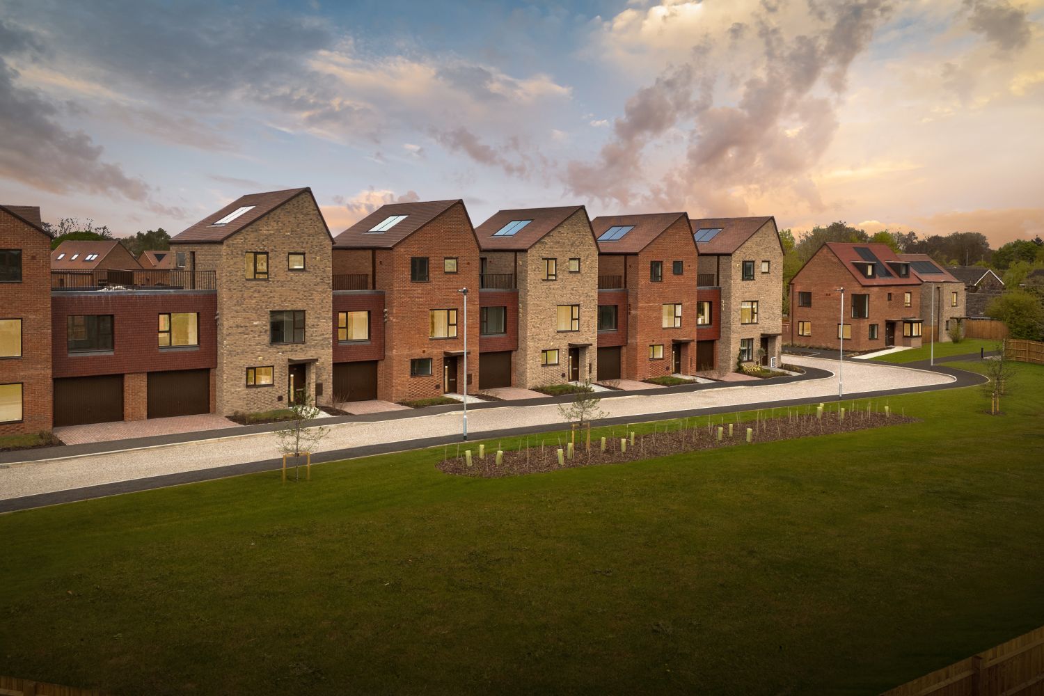 HOMES OVERLOOKING OPEN SPACE AT DUSK