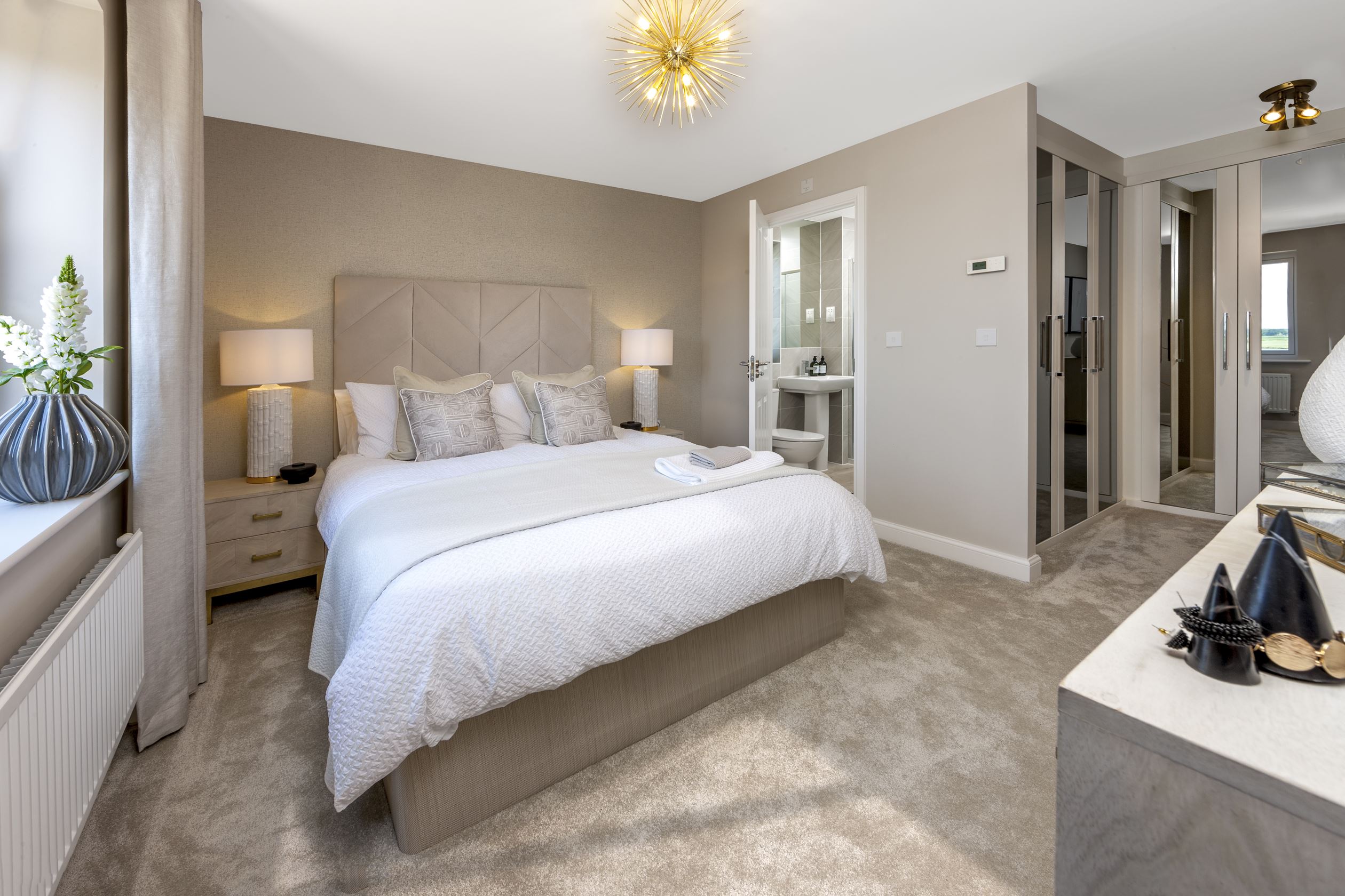 main bedroom with double bed and en suite internal view
