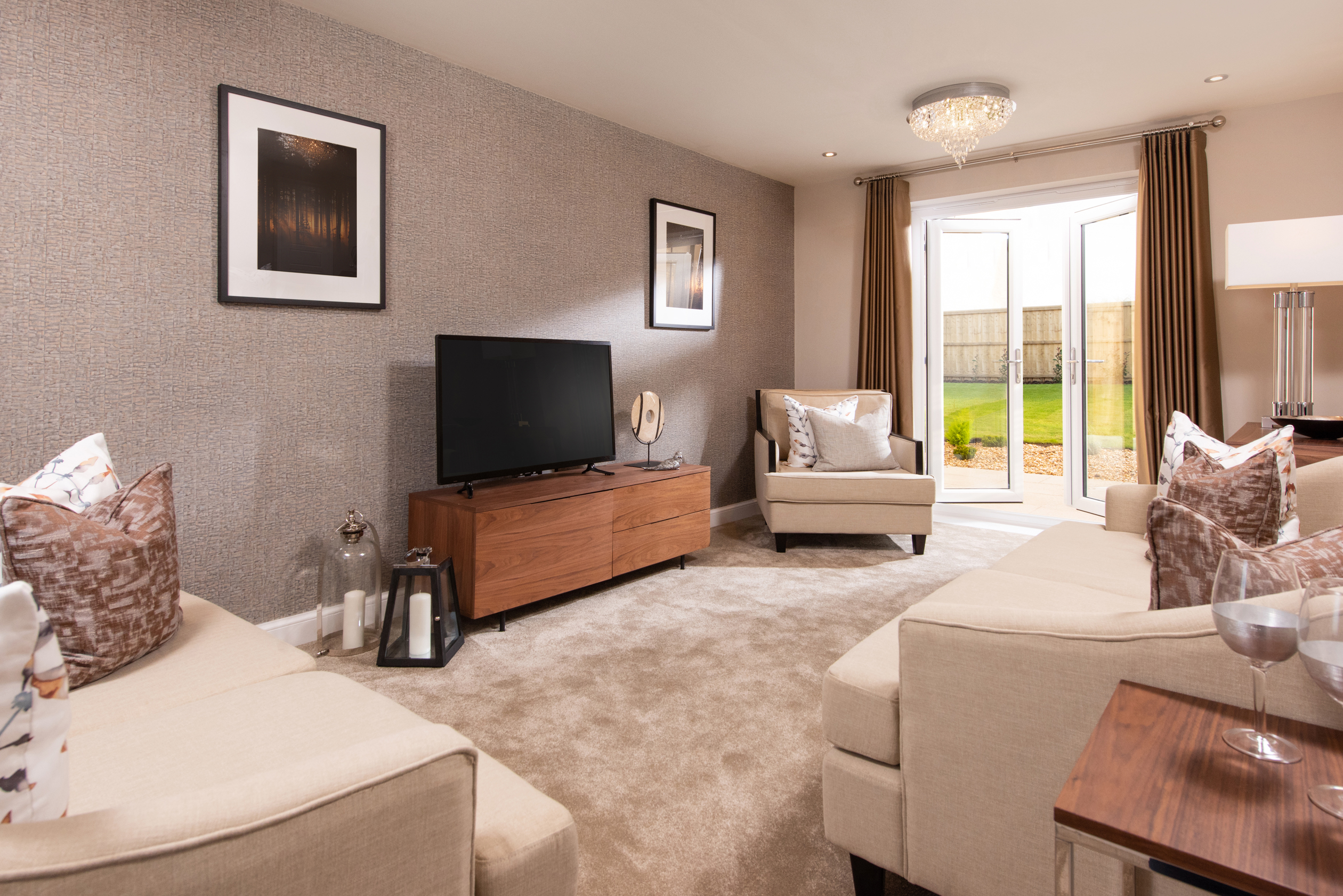 Internal image of the lounge with french doors leading to the garden in the Alderney housetype 