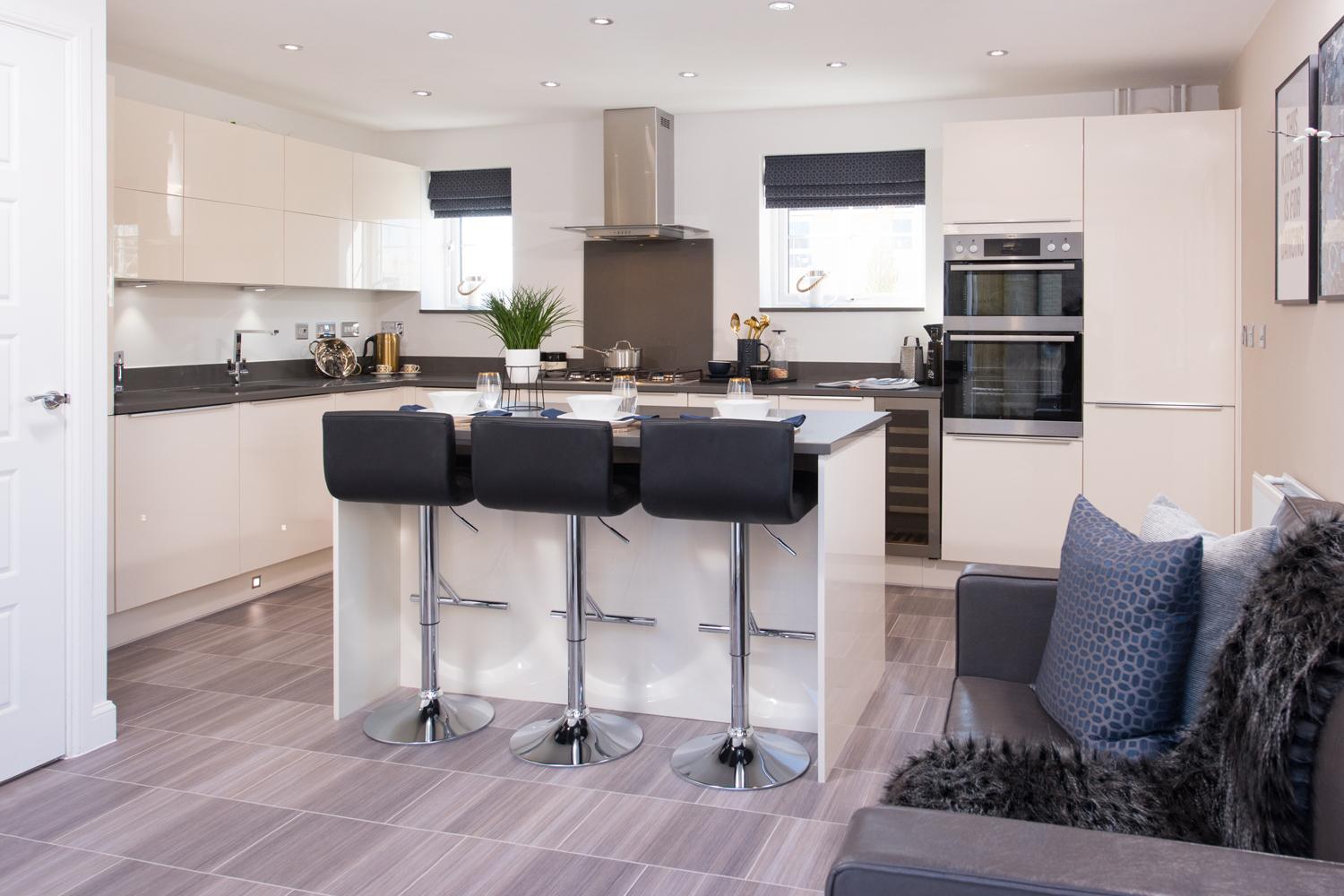 4 bedroom detached home the Alderney internal image of kitchen with breakfast island and family sitting area 