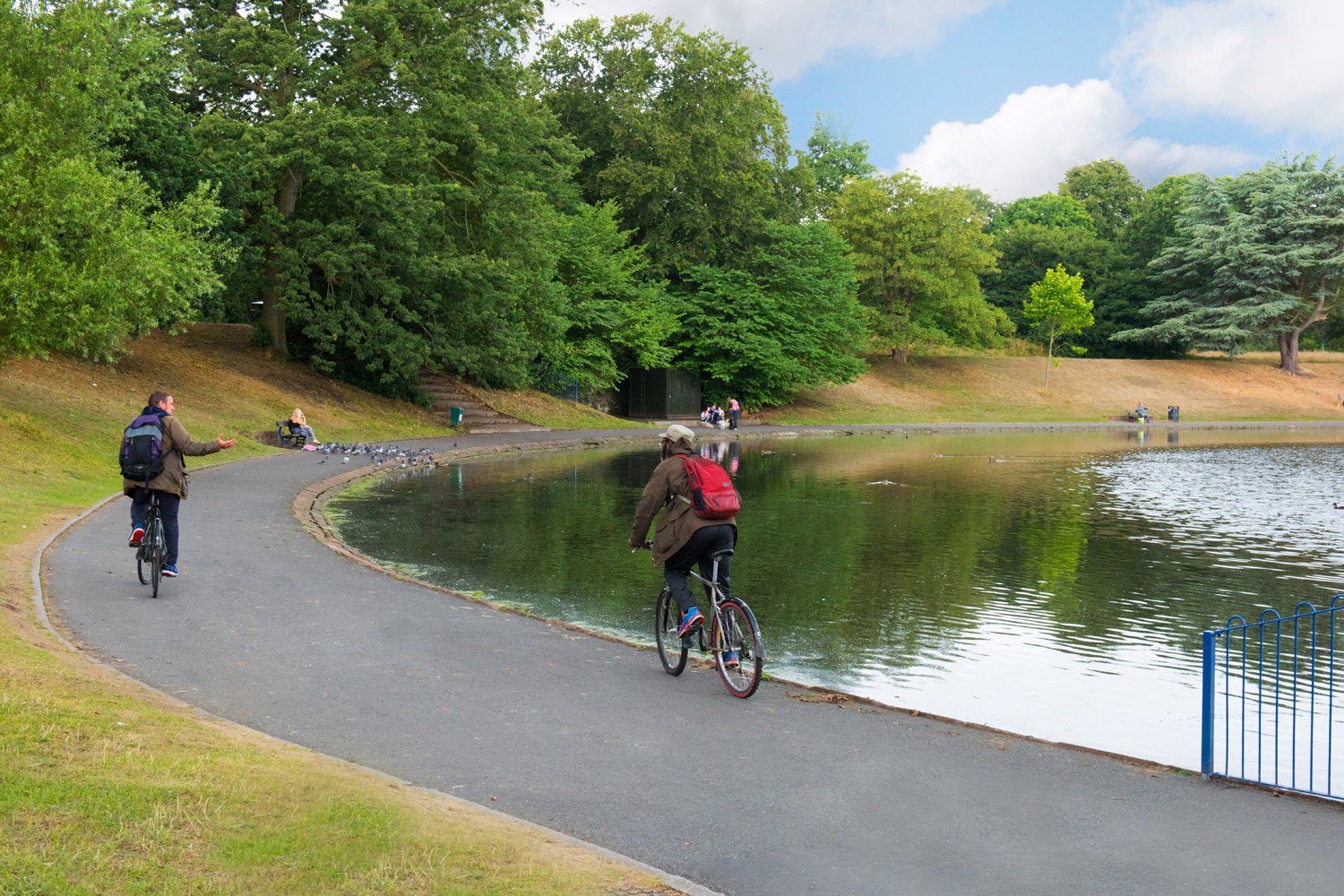 local park with lake and path for walkers and cyclists 