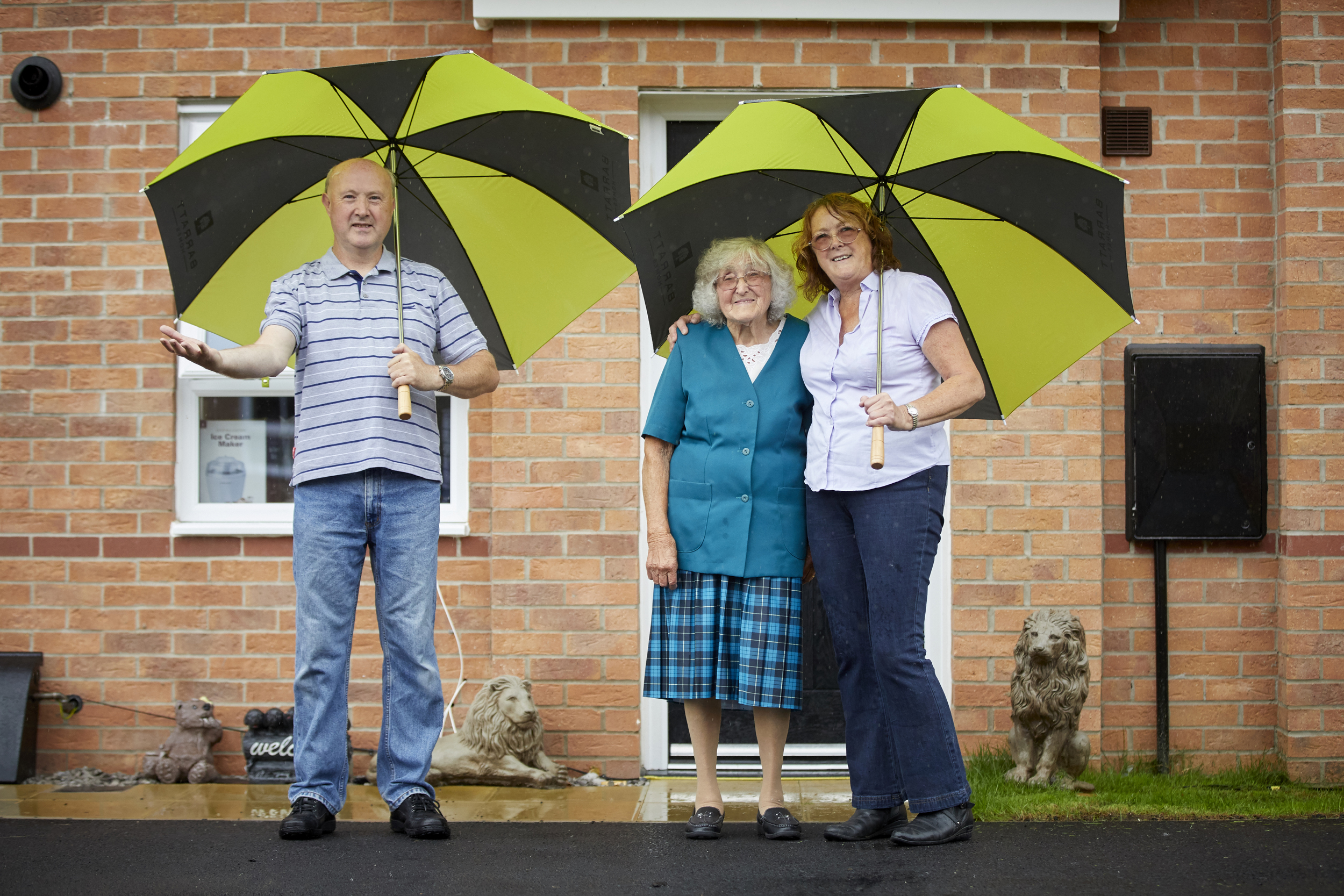 happy buyers who moved into their new home at imperial park two with their elderly mother  