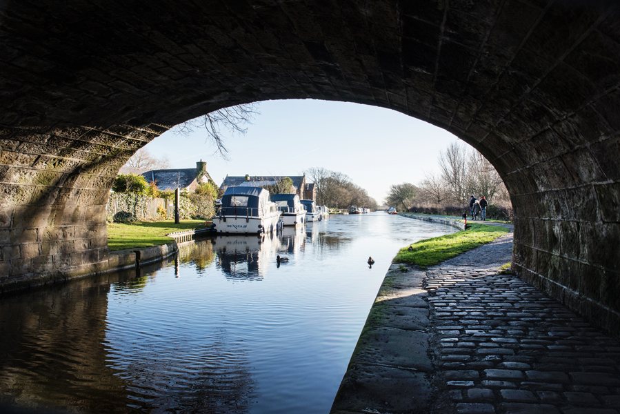 Image of boat under bridge on the River Wyre