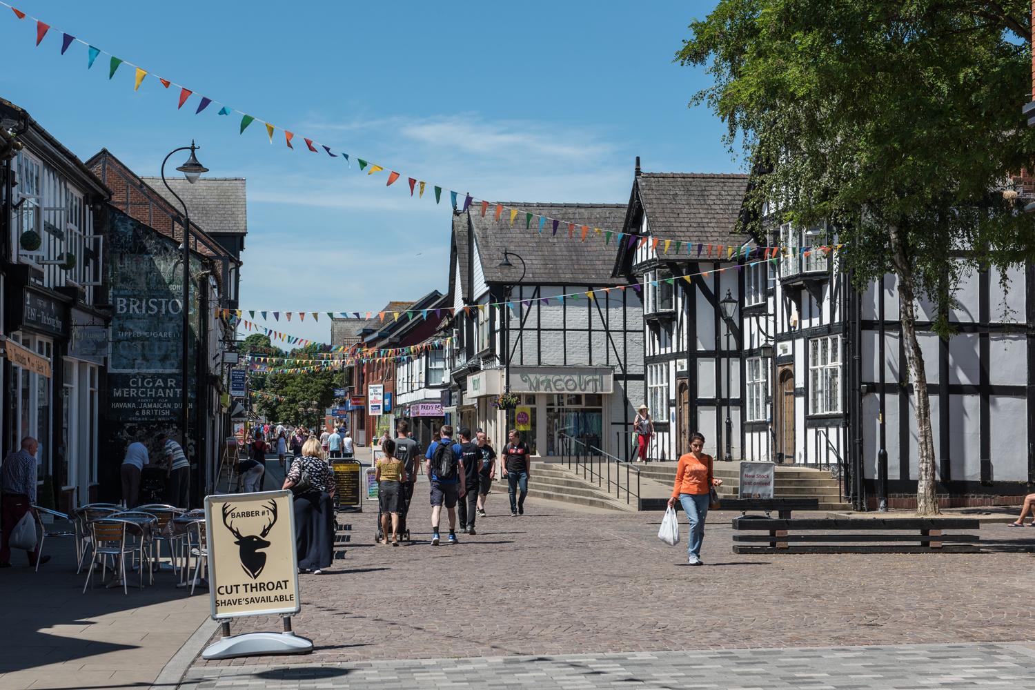 Northwich town centre with Tudor style high street shops and cafe 