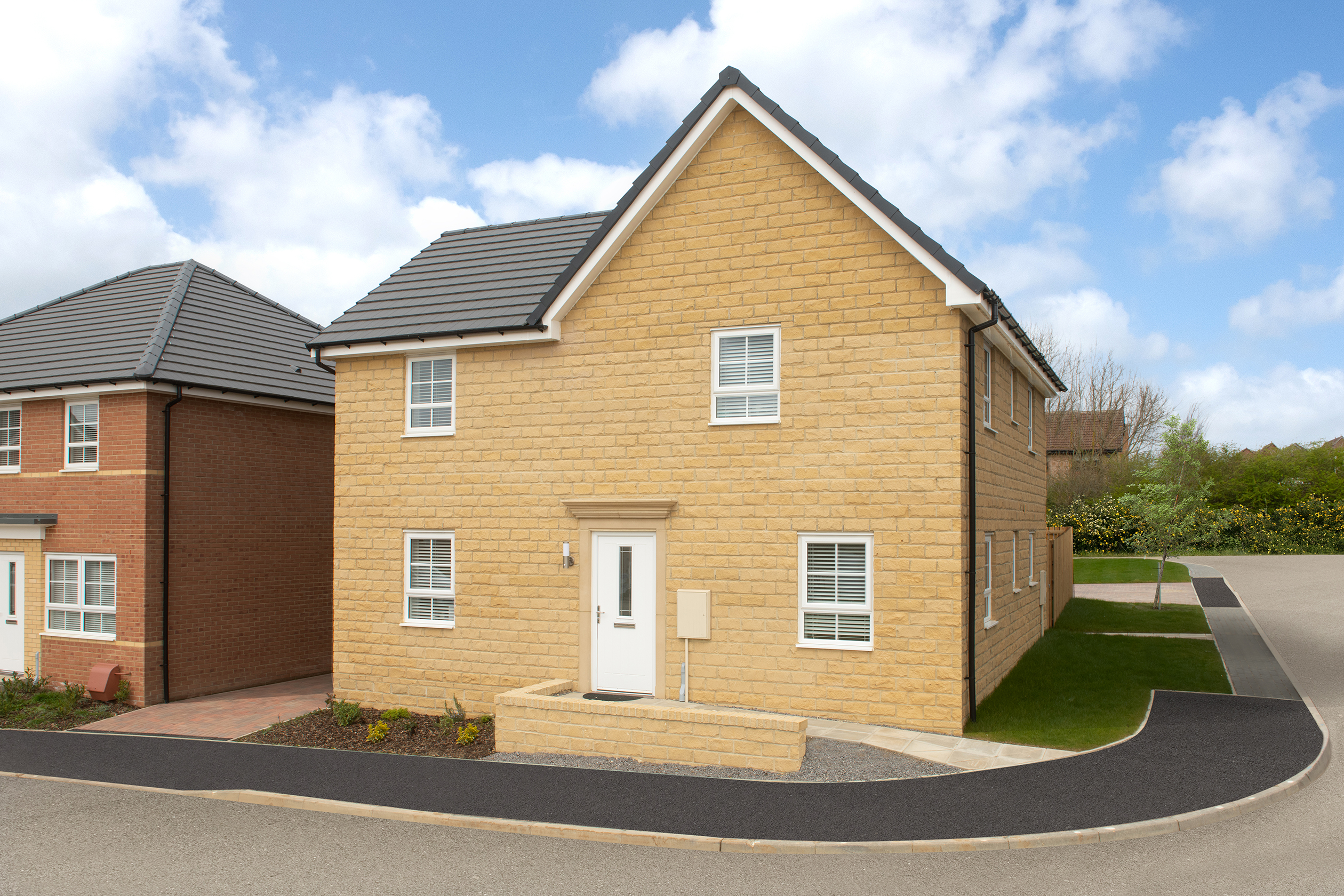 Outside view 4 bedroom detached stone built Alderney home