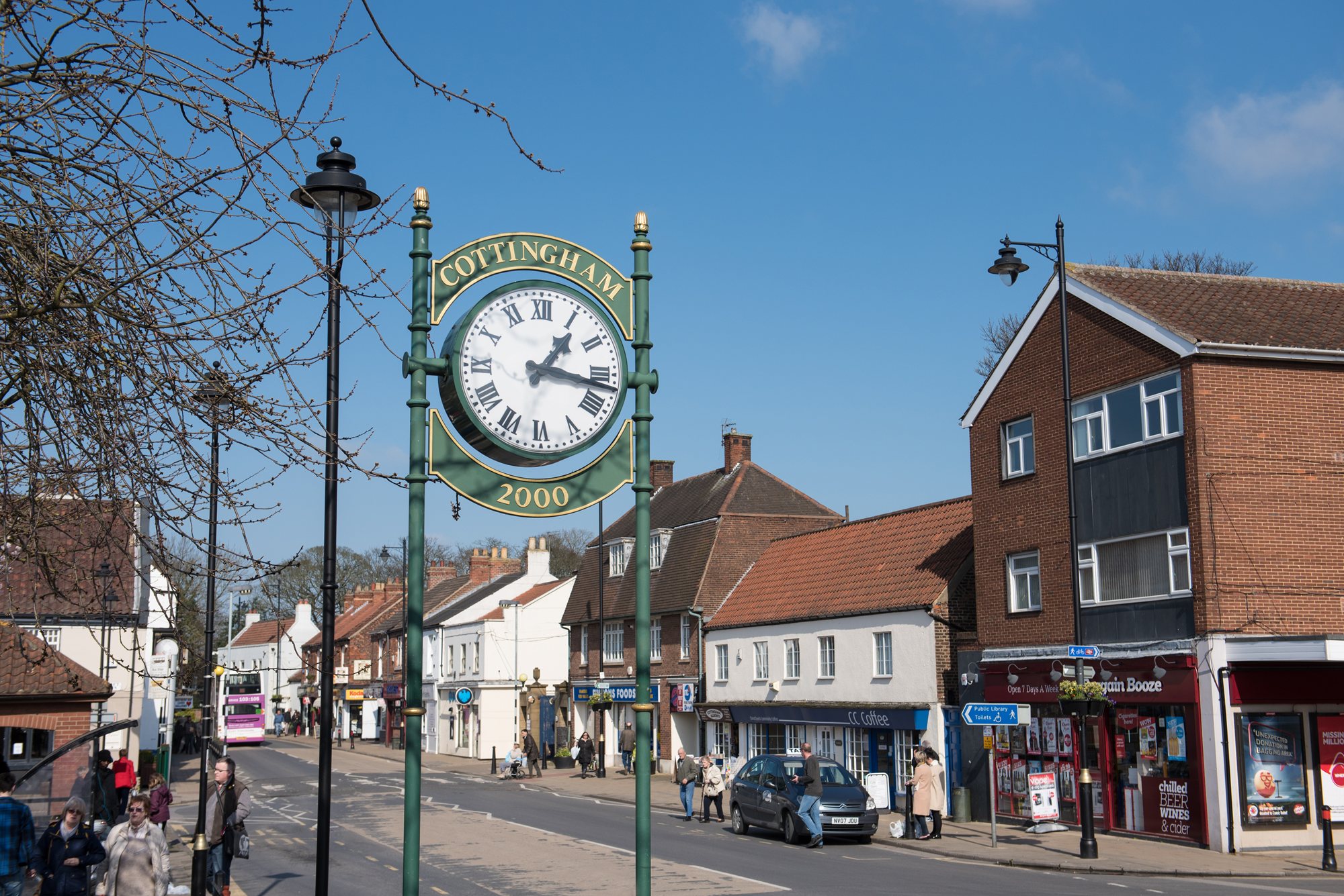 Traditional clock and Cottingham street scene 