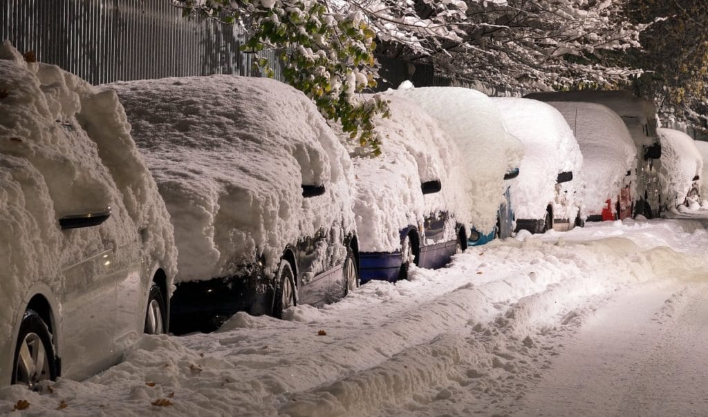 Cars covered in snow