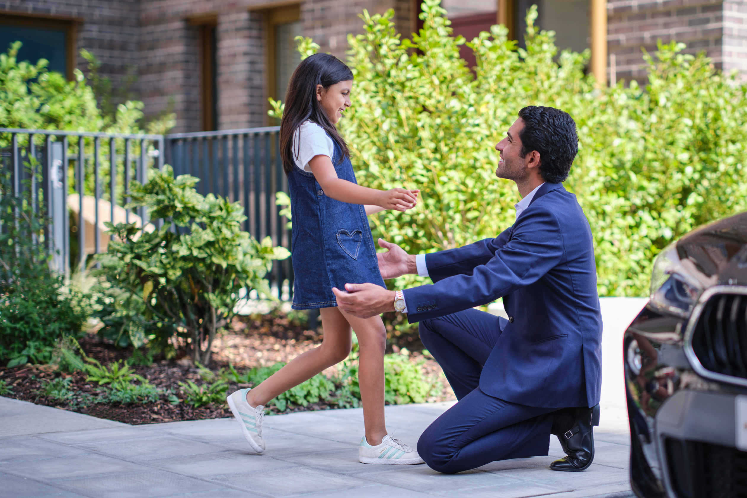 Father and daughter greeting each other