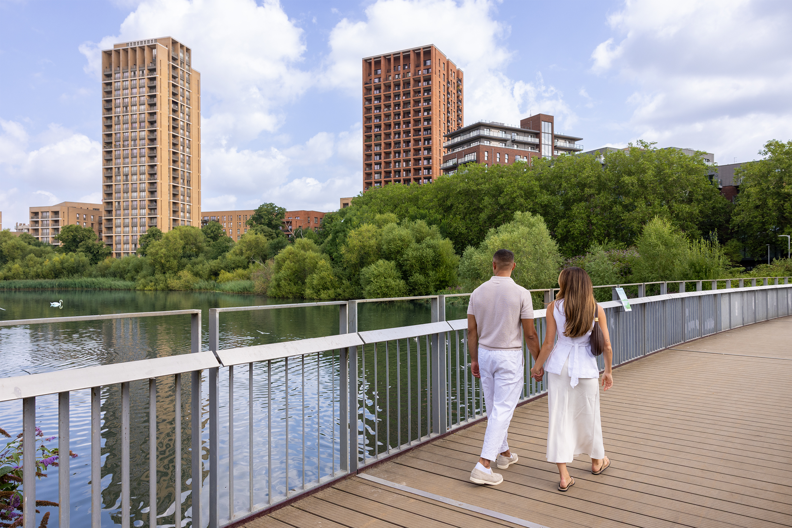 couple walking across the bridge 