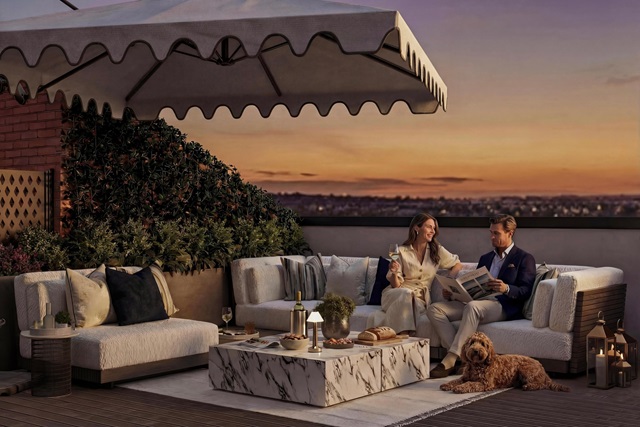 Couple sat on penthouse balcony